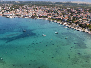 High angle view of sea and buildings in city