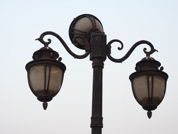 Low angle view of street light against clear sky