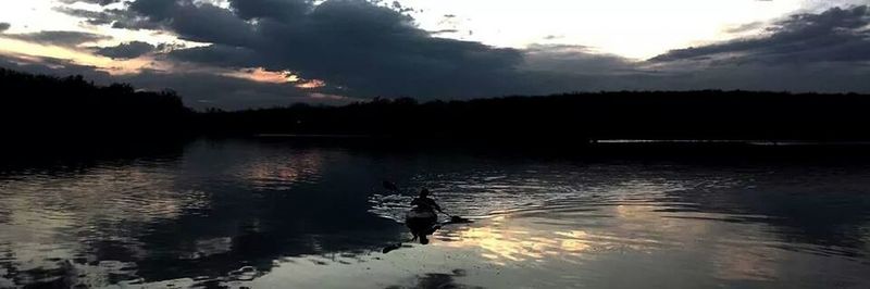 Scenic view of lake at sunset