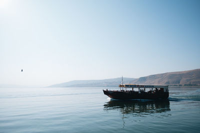 Boat on sea against clear sky