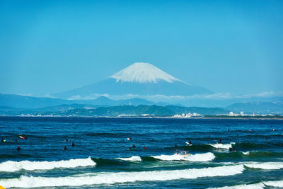 Scenic view of sea against blue sky