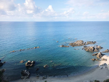 High angle view of sea shore against sky