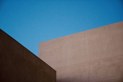 Low angle view of building against blue sky