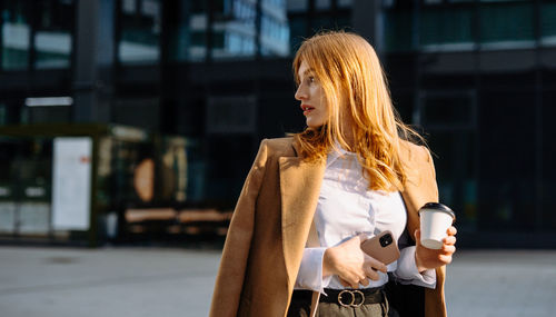 Young woman standing in city