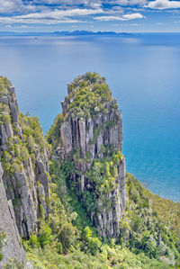 Panoramic view of sea and mountains against sky