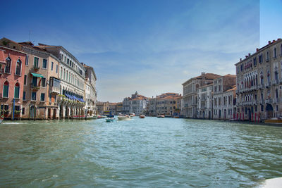 Canal amidst buildings in city