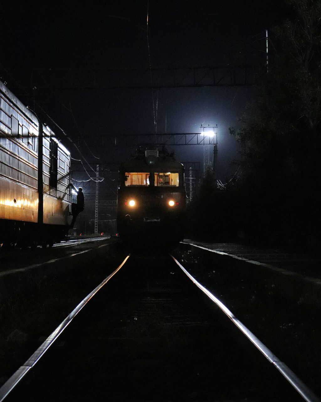 transportation, mode of transportation, rail transportation, track, illuminated, railroad track, night, train, public transportation, train - vehicle, the way forward, lighting equipment, direction, land vehicle, no people, motion, on the move, outdoors, headlight, travel