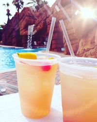 Close-up of drink on beach