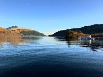 Scenic view of sea against clear blue sky