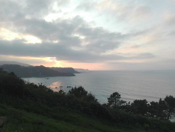 Scenic view of sea against sky at sunset