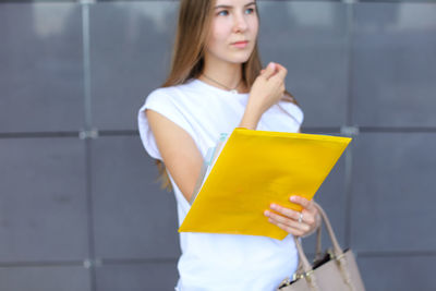 Young woman holding shopping bags