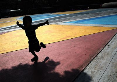 Shadow of woman on road