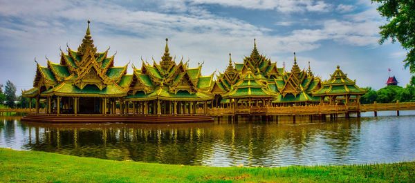 Gazebo in front of temple against sky