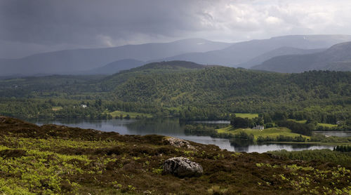 Scenic view of lake with mountains in background