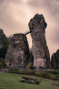 Rock formations on landscape against sky