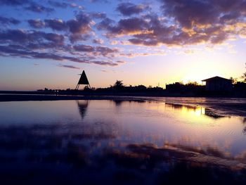 Scenic view of lake at sunset