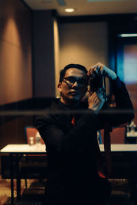 Young man wearing sunglasses standing outdoors