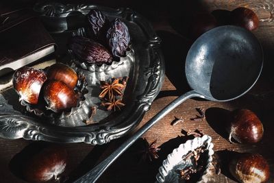 High angle view of chestnuts and spices on table