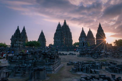 Panoramic view of temple building against sky during sunset