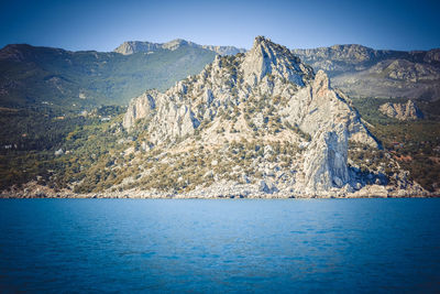 Scenic view of sea against clear blue sky