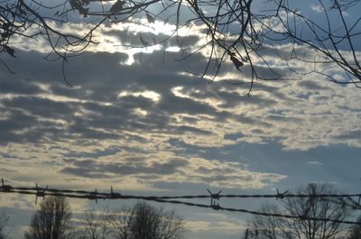 Low angle view of electricity pylon against sky