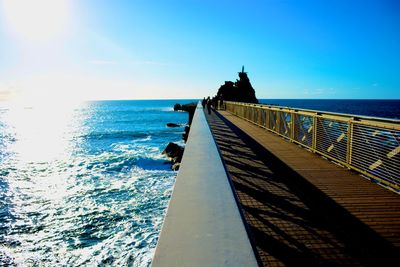 Pier on sea against sky