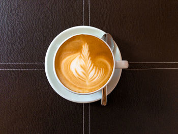 High angle view of cappuccino on table