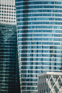 Low angle view of modern glass building in city