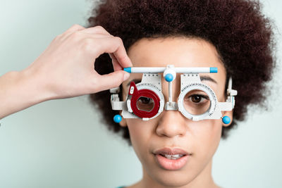 Portrait of woman wearing eye test equipment 