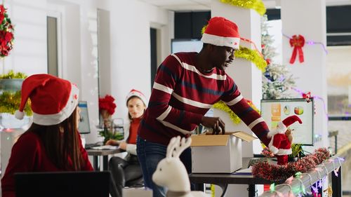 Portrait of woman holding christmas presents