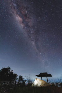 Low angle view of built structure against sky at night