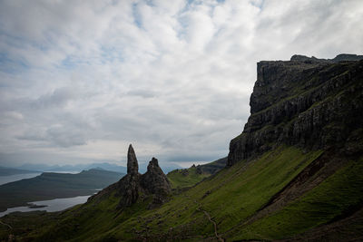 Panoramic view of rocks on land against sky