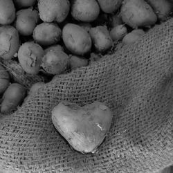 Close-up of heart shape on sand