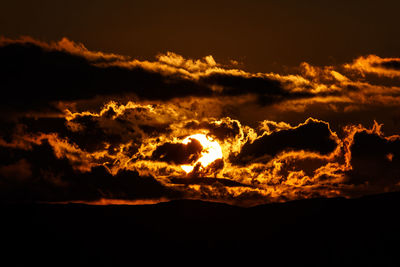 Low angle view of dramatic sky during sunset