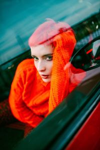 Portrait of young woman in car