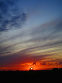 Low angle view of dramatic sky during sunset