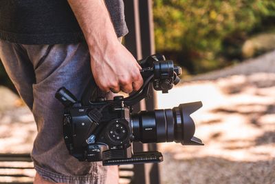 Midsection of man photographing