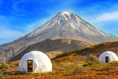 White glamping on the slope of a volcano in autumn on the kamchatka peninsula. selective focus