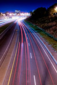 High angle view of light trails on road at night