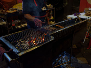 Cooking satay on the street