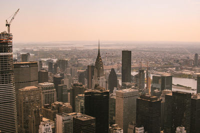 High angle view of city buildings against sky