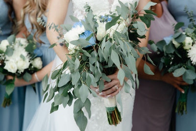 Bridal wedding bouquet - white roses, blue and purple chrysanthemum, eucalyptus leaves, baby breaths