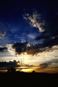 Silhouette landscape against sky during sunset