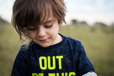 Portrait of boy on field