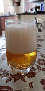 Close-up of beer glass on table