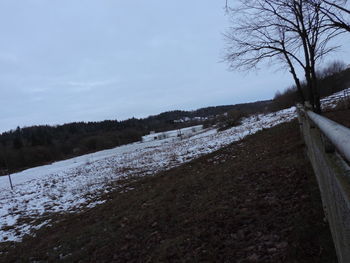 Scenic view of landscape against sky during winter