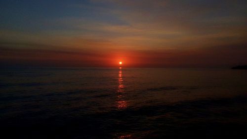 Scenic view of sea at sunset