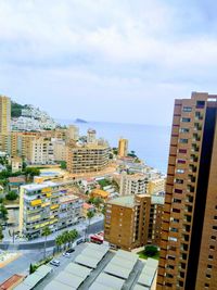 High angle view of buildings in city against sky