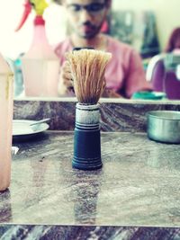 Close-up of paintbrushes on table