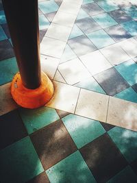 Close-up low section of tiled floor